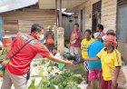 Satreskrim Polres Boven Digoel Bagikan Masker dan Makanan Untuk Para Pedagang di Pasar Mumanjakowa