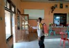 Bhabinkamtibmas Waninggap say dan Aparat laksanakan Penyemprotan Disinfektan