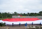 Menggunakan Sepeda ke Titik 0 Km Indonesia, Danrem 174 Merauke Bentangkan Merah Putih Raksasa