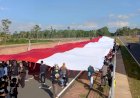 Membentangkan Merah Putih Raksasa Berukuran 76 Meter Pada Sirkuit Termegah Di Ujung Timur Indonesia