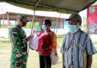 Ajak Sukseskan PON XX Dan Vaksinasi, Danrem 174 Merauke Bagikan Bingkisan Bantuan Presiden RI