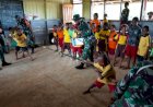 Koramil Waropko, Satgas Pamtas RI-PNG Y 410/Alugoro, dan Puskesmas Waropko Ajak Murid SD Belajar sambil Bermain