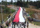 Dandim 1711/BVD Bersama KSC, Bentangkan Bendera Merah Putih Raksasa di PLBN Yetetkun