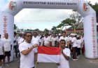 Pj. Bupati Mappi Pimpin Pembagian 5000 Bendera Merah Putih Dirangkaikan Dengan Collour Run Bersama Masyarakat